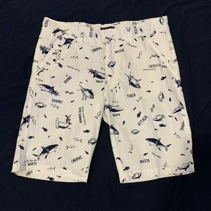 Boys white shorts with blue ocean related prints
